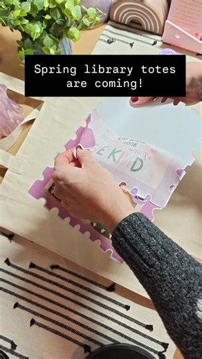 @songbirdmarket_co on Instagram: "Just finished my first spring library tote bag prototype. I need to jazz up the bushes in the illustration and add more flowers. I had no idea how GOOD my printer actually was until I printed this off and saw all the tiny details I missed on my computer screen. Can't wait to add this to my Spring Collection once it's fully finalized! #smallbusiness #totebags #librarylove #bookishlife #howitsmade"