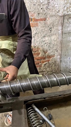 62K views · 161 reactions | Watch the fascinating process of transforming simple metal wire into a strong spring using a vintage gearbox machine and hand tools. A skilled master demonstrates true craftsmanship, precision, and patience in every turn. Pure old-school mechanical art in motion! #SpringMaking #VintageMachine #MetalWork #OldMachineCraft #HandmadeSpring #WorkshopSkills #Craftsmanship #EngineeringArt #LatheWork #SkilledMaker #TraditionalSkills #Reels | Creators Craft | Facebook