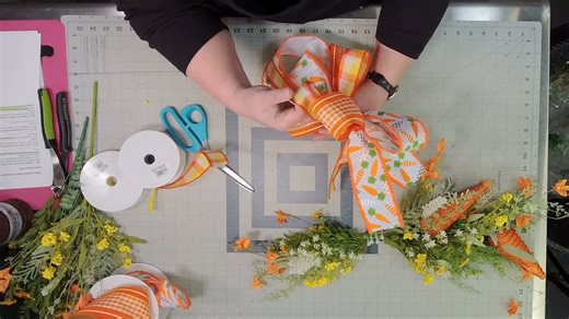 We are so excited to share this Spring Carrot Lantern Swag tutorial with y'all tonight. It's a fun, fresh project that’s perfect for Easter and all of spring. In this tutorial, Coach Julie will walk you step by step through how to build a swag that has great movement, balanced florals, and just the right amount of whimsy. If you're planning your spring designs, this one is for you! Let's hop to it. ;) | Southern Charm Wreaths