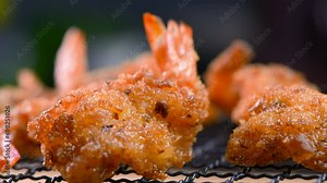 Breaded fried shrimp with a crispy crust, Very easy to prepare and you will enjoy delicious results. Episode from a series of video recipes for making breaded fried shrimp. Close-up, Slow motion