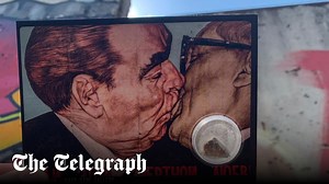 Who are the anonymous buyers queueing up to buy a piece of the Berlin Wall?