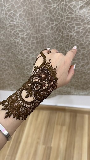 Intricate Henna Design Application on Human Hands