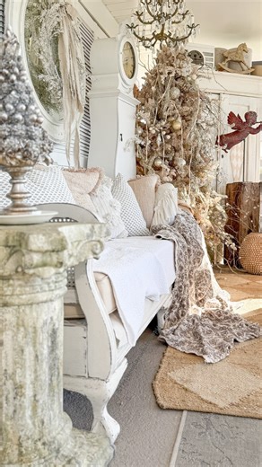 Jules Hodgson cozy decor neutral vintage farmhouse on Instagram: "Do you have an angel watching over you? In a world full of trends, choose the pieces that feel like guardians. This angel has a quiet way of watching over the room — a timeless treasure you’ll still be reaching for decades from now. From my lovely friends @cottonandcrete ~ Christmas tree topper – Verdigris finished flying angel with stand ~ Glittered pinecone and acorn tree on pedestal – comes in two sizes ~ 24” Courtyard garden p