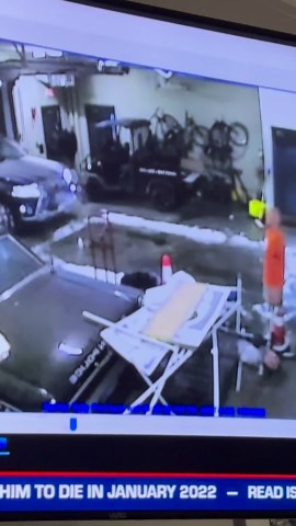 The cop pulls the car in to the sally port then hops out of the passenger side? Video is flipped.