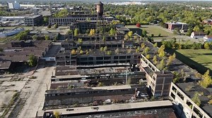 Old Packard Plant with rusty water tower in Detroit, Michigan. Aerial drone view