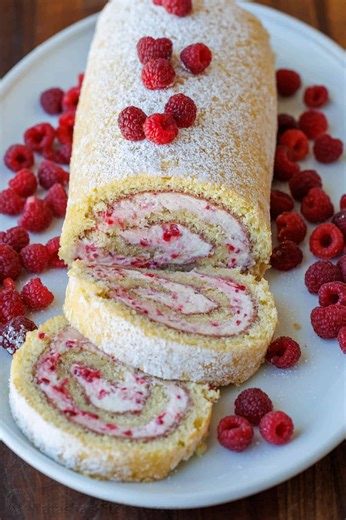 This Easy Swiss Raspberry Cake Roll is Stunning!🤩 Recipe: https://natashaskitchen.com/raspberry-swiss-roll-cake/ | NatashasKitchen.com