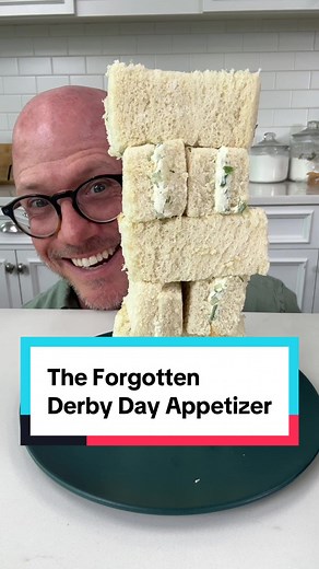 Ingredients: -2 (8-oz.) pkgs. cream cheese, softened -1/2 cup green onions, minced -1 cup cucumber, peeled, seeded, and chopped -4 Tbsp. dill, chopped -2 Tbsp. mayonnaise -1/2 tsp. pepper -1/2 tsp. salt -2 loaves sliced white bread Directions: -Stir together first 7 ingredients to create Benedictine spread. -Spread mixture on 24 slices of white bread, and top with remaining bread slices to create sandwiches. -Trim away sandwich crusts, and cut each sandwich into 4 triangles with a serrated knife