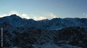 Rocky Mountains And Hills With Snow In Sierra Nevada Range In Inyo County, California. drone pullback shot