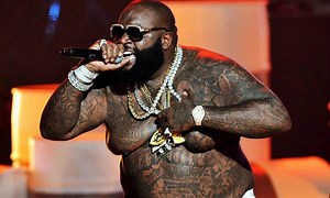 What Rick Ross’s Belly Tattoo Actually Says [PHOTOS]