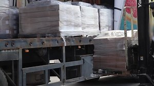 clip-23991490-forklift-loads-packages-into-truck