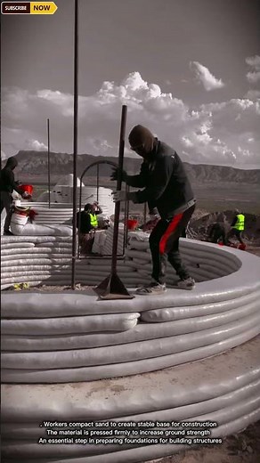 Workers Compacting Sand for Strong and Stable Building Foundation Preparation
