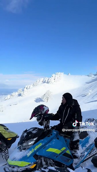 Exploring Snowy Mountains on Snowmobiles