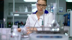 Young woman scientist preparing for laboratory working. Female scientist preparing. Young researcher in lab. Scientist in lab. Woman in lab coat. Scientist woman in science laboratory Stock Video
