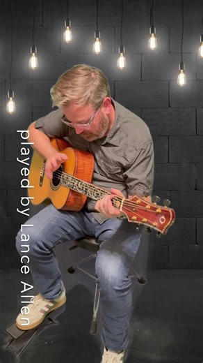 Tapping on our Olson 5A Koa Guitar at Guitar Gallery TN.