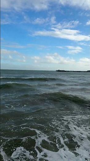 High tide and waves hitting the seawall at Swanage beach this morning