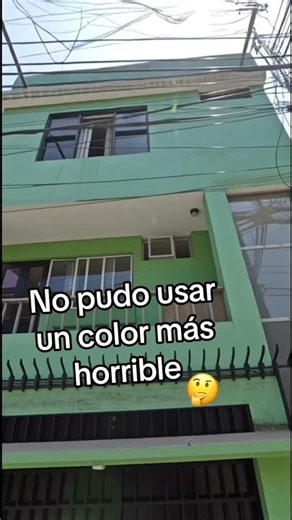 The house is painted a green color that is not appropriate for a house. #house