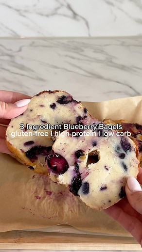 (easy air-fryer) 3 INGREDIENT BLUEBERRY BAGELS 🥯💙 OMG…how delicious do these look!!! Ever crave a fresh, homemade bagel but don’t want to spend hours in the kitchen? I’ve got you covered with super simple & delicious gluten-free and ✨high protein✨ blueberry bagels. These were gone QUICK! INSTRUCTIONS: 1.) Mix equal parts non-fat Greek yogurt (regular or diary-free) and gluten-free self-rising flour (I used 1 cup of each for 3 bagels). No self-rising flour? No problem! Just add 1½ tsp baking po