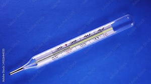 mercury thermometer. The mercury column, temperature rises to 42 degrees