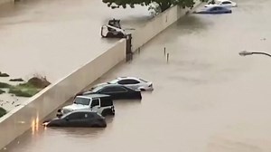 Tropical Cyclone Shaheen causes widespread flooding with vehicles submerged and power cut.