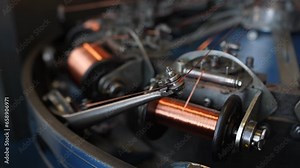 Cables, wires production process. Industrial production . Making braid pipe, cable sleeves. Manufacture of metal shielding braids for electrical cables. High-speed braiding machine