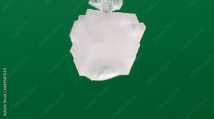 Time-lapse of the formation and growth of a crystal from a saline solution