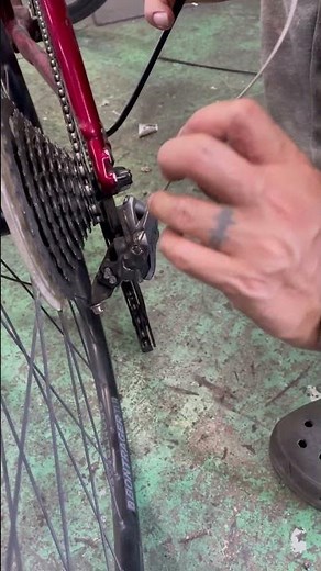 Installing the rear derailleur (RD) shifter cable on a TREK cross bike.