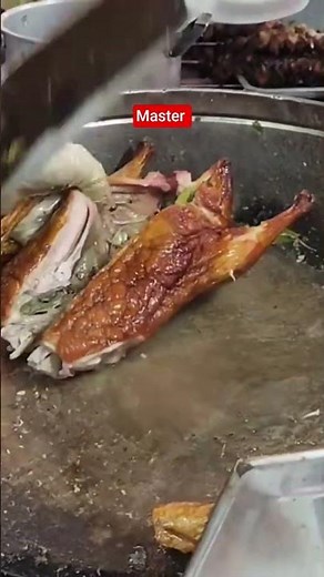 Watch a master butcher chop duck meat incredibly fast in Vietnam.