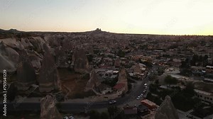Goreme, Cappadocia, Turkey. The ancient city unfolds below, revealing its extraordinary charm with cave houses. Aerial view. Popular tourist destinations.