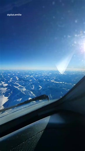 Winter Flying: Serenity Over Snow-Capped Mountains