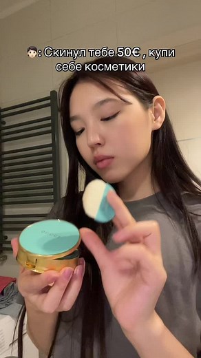 Compact Makeup Product Demonstration in Bathroom