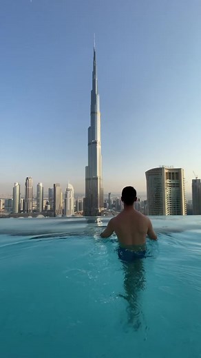 Man Enjoying Scenic Infinity Pool View in Dubai