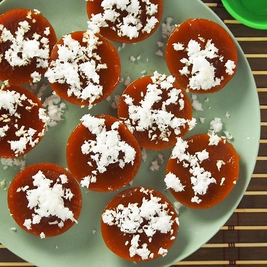 Try this delicious Kutsinta (cuchinta) recipe! Soft, chewy, and topped with grated coconut, these steamed Filipino rice cakes make a great snack or dessert. Get the full recipe: https://www.kawalingpinoy.com/kutsinta/ | Kawaling Pinoy Recipe Blog