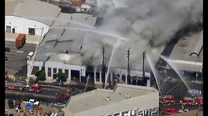 Dozens of firefighters respond to massive commercial building fire in California