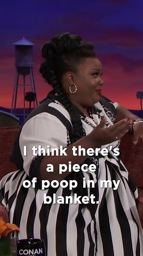 Nicole Byer found a piece of poop in her in-flight blanket. | Team Coco