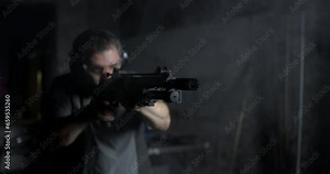 Man Firing Powerful Shotgun, High-Speed 800fps Slow-Motion Capture speed-ramp, Impactful Gun Shot with smoke everywhere Stock Video