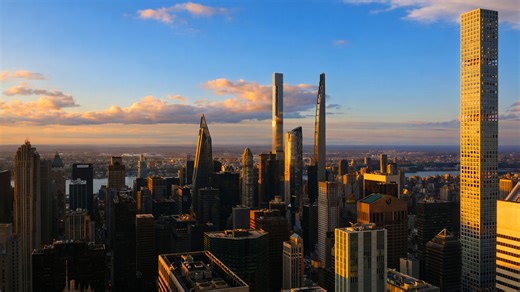 Luxury city skyline with tall towers and evening glow