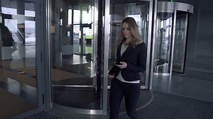 Attractive business woman walking in office building. SLOW MOTION