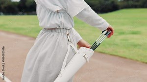 Archery, arrow and training with person in Japan for shooting game, challenge and target practice. Competition, skill and weapon with sports quiver and athlete in field for score, aim or bullseye