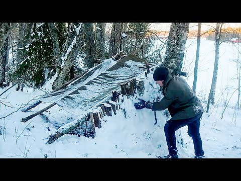 Winter Bushcraft - Building a Primitive Shelter with Snow and Wood for Survival