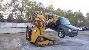 Watch Mechanics Destroy an SUV With the Power Loader From Aliens They Built