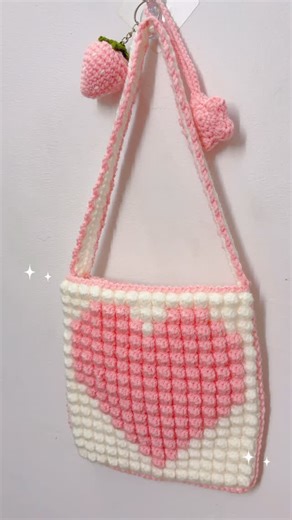 Lily ♡ | Crochet on Instagram: "💌 Made this tiny pixel tote using bobble stitch☺️ I was actually making a mini cushion at first… but then I thought, why not turn it into a bag? And honestly… I love it even more! 📝Update- Free pattern uploaded on my blog. Plz check it out😊 . . . [cute mini bobble stitch pixel crochet tote bag, aesthetic crochet handbag tutorial, easy textured bag pattern, handmade pixel design bag, cute aesthetic crochet bag pattern, diy crochet project, pastel handmade croche
