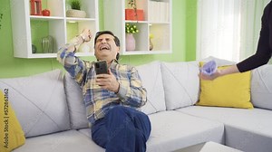 A cleaning addicted woman gets angry when she sees her husband sitting comfortably and forces her husband to clean.