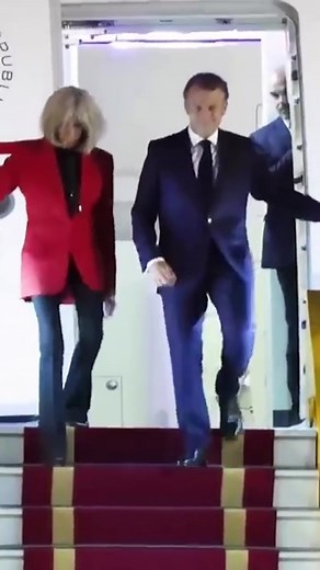 180K views · 1.6K reactions | French President Emmanuel Macron was seen getting shoved in the face by his wife. Video captured Brigitte Macron's red sleeve coming into frame and forcefully hitting his face during a state visit to Vietnam. At first, Macron's office claimed the video was an AI-generated fake. Then the French president admitted the moment was real. The moment pushed their relationship into the spotlight. Brigitte is 72 and there is a 24-year age gap. | Inside Edition | Facebook