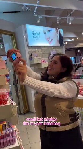 Capture your favourite moments with the Mini Digital Camera! 📸 It’s pink, only $39.95, small enough to throw in your handbag on a night out and takes great pics to save as memories forever 💖 #SportsgirlStyle ID: video instore showing the digital camera, then Georgia using the camera to take selfies. | Sportsgirl