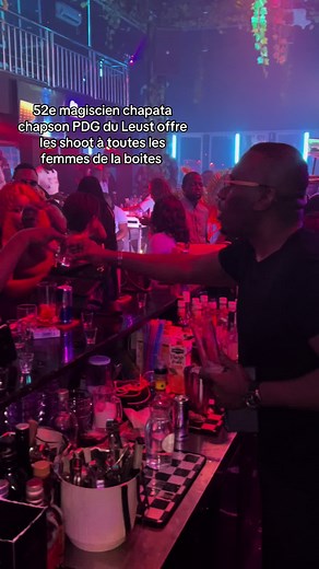 Vibrant Nightclub Bar Scene with a Skilled Bartender