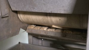 Olives falling into a crushing machine to make olive oil - Free Stock Video