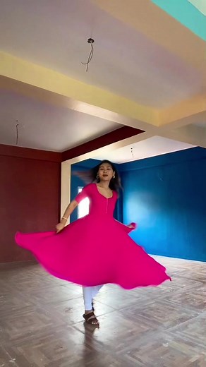 Elegant Twirling in a Bright Pink Dress