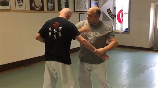 A Kusanku Sho bunkai for the return from the kick and backfist motion that commonly looks like an outside block. But remember, angled arm positions have multiple uses! In this case, the (not shown here) backfist would be a heavy strike against the side of the neck after a groin or leg kick. Keep the arm tight to their body. Here we demonstrate it slowly. At speed, it is a very sharp twisting down and a sharp pull upwards on the arm as they fall. # kusanku #bunkai #ihadojo #beikokushidokan | Orig