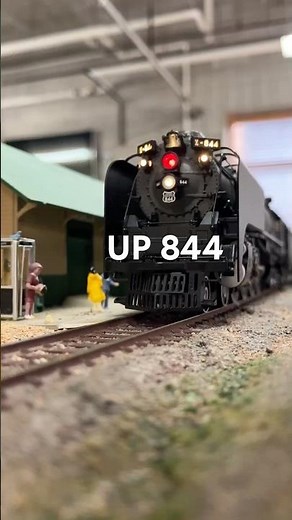 Union Pacific 844 departing from the station ho scale model train