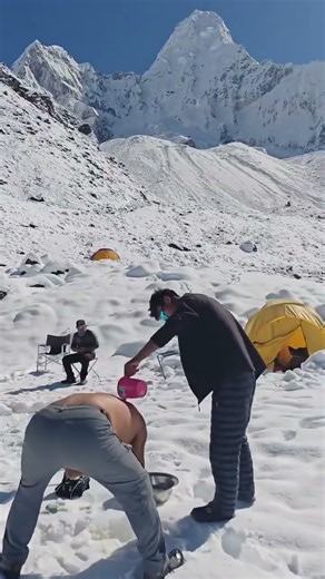 Our guide uncle telling us about the benefits of taking bath from the water comes from the mountains